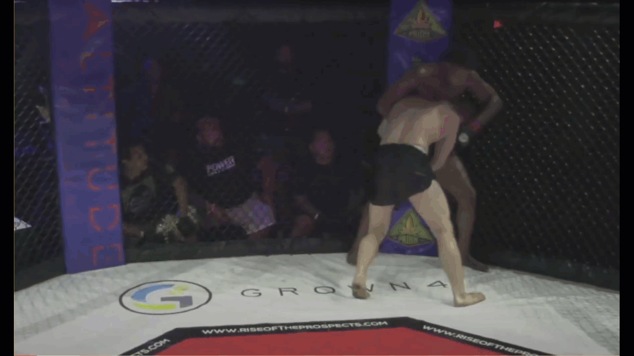 Pressing against the cage and stepping his leg over, second example